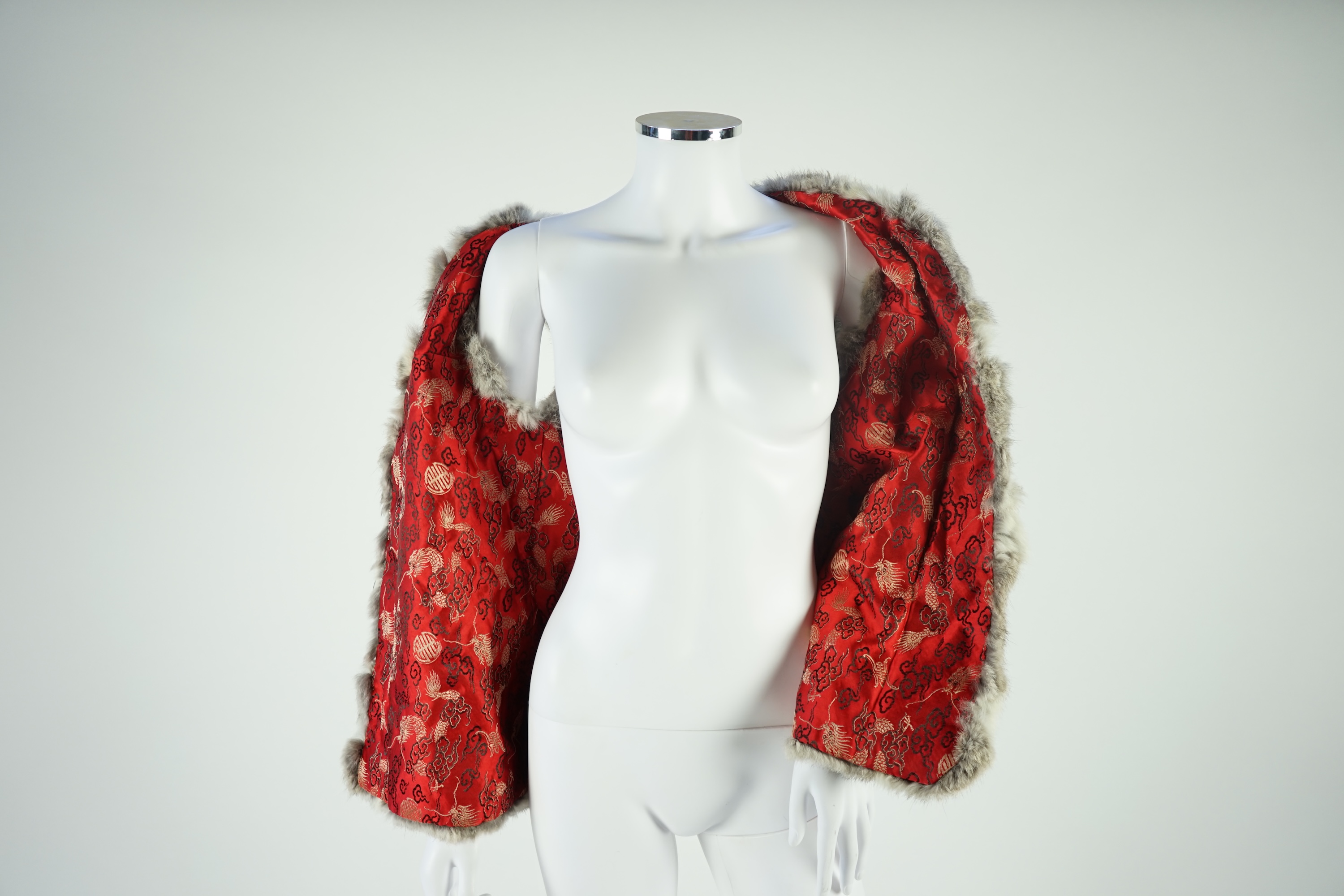 A selection of fur scarves and a fur gilet